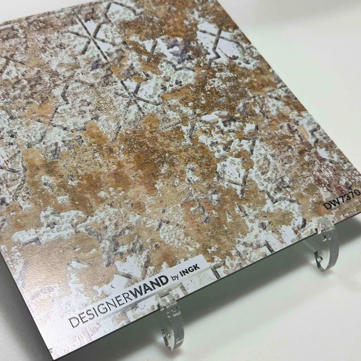 Sample of Concrete Ornament backsplash DW7370 with weathered concrete print and ornate motifs