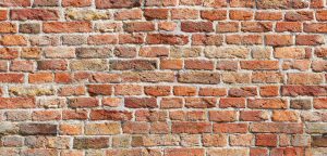 Design of a red and orange brick wall with white pointing