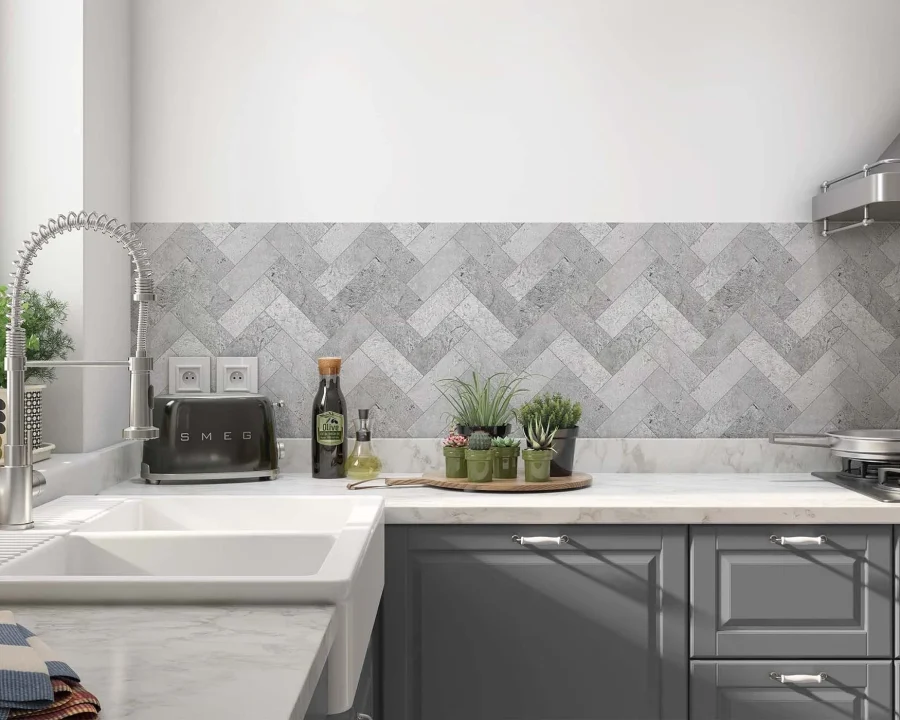 Grey herringbone tile-look backsplash DW8530 in modern kitchen with dark grey cabinets and marble worktop