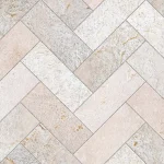 Design of beige travertine tiles laid in a herringbone pattern