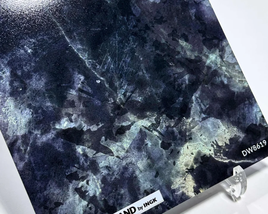 Sample of dark marble backsplash DW8619 in blue-grey tones with natural marble veins.