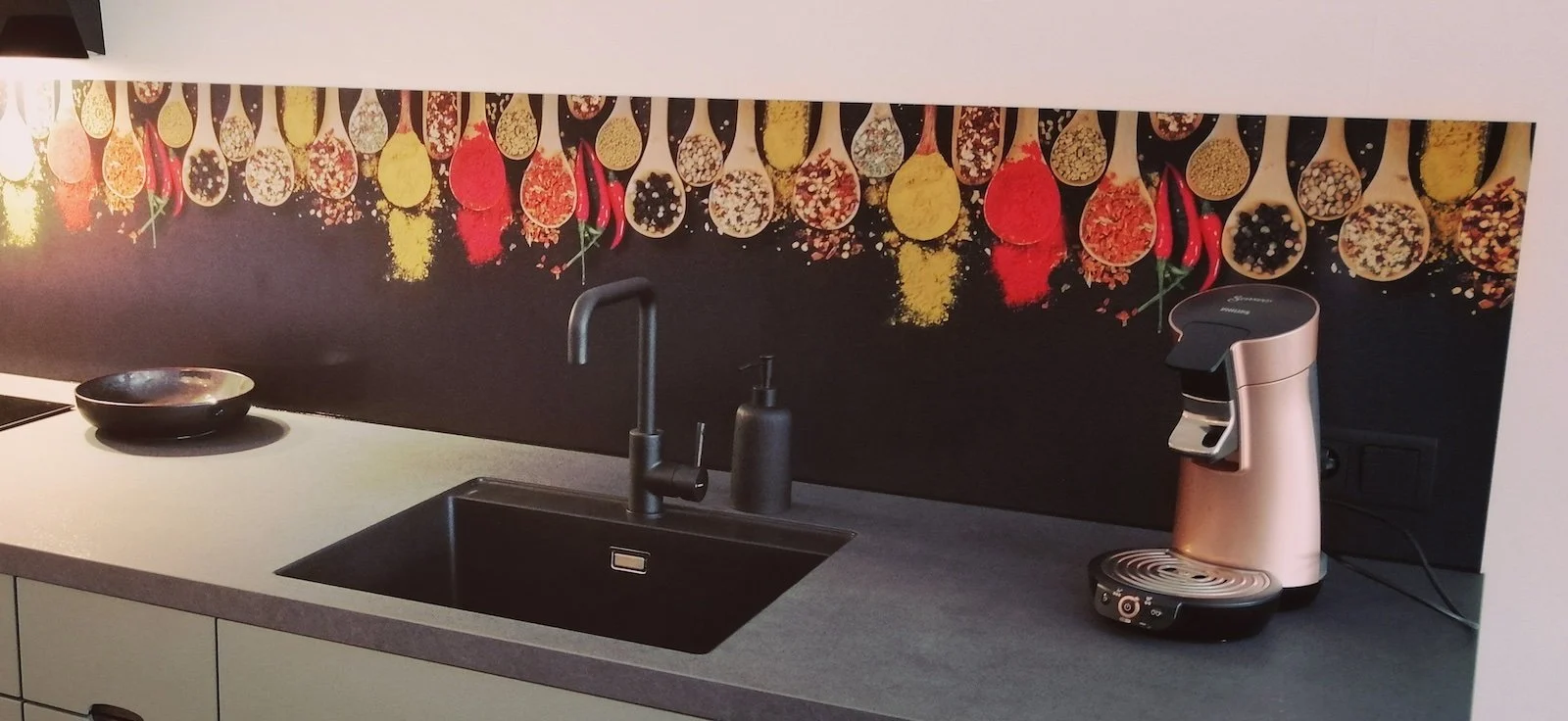 Colourful herbs backsplash FW1012 with wooden spoons full of spices on dark background in modern kitchen with dark worktop