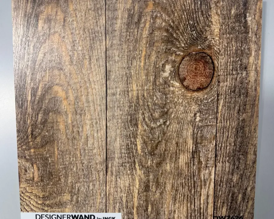 Material sample DW7626 with the realistic wood grain print and vertical planks for a warm kitchen backsplash