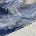 Detail van bedrukte schoonloopmat – zachte velours toplaag met realistische marmerprint