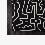 Deurmat met rand met zwart-wit figurendessin