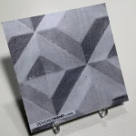 Échantillon DW7613, 20x20 cm, effet béton à motif géométrique en étoile, tons gris